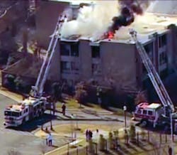 Prince George's firefighters rescued four people from a second-floor balcony with the use of a ground ladder. Prince George's firefighters rescued four people from a second-floor balcony with the use of a ground ladder.