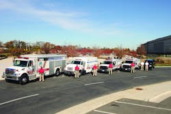 CBRNE Response Division vehicles in front of the Pentagon 911 Memorial. In the background is the west side of the Pentagon at the location where the plane hit the building on 9/11.