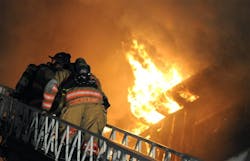 Firefighters battle flames at a fire in Brattleboro, Vt.