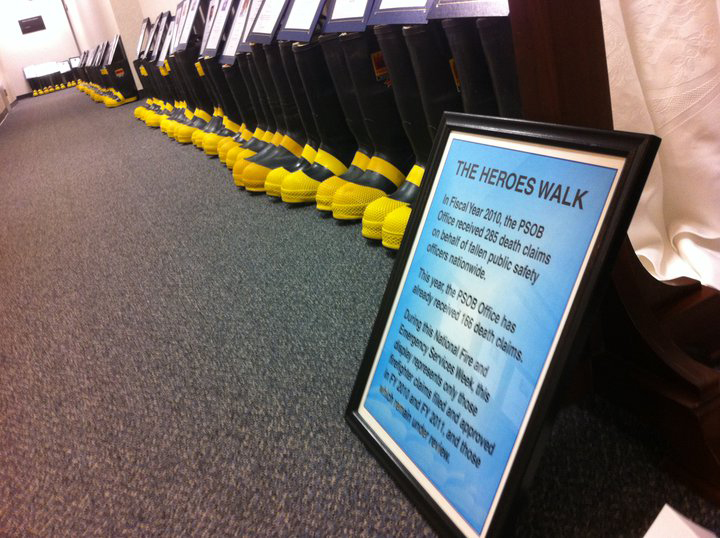 Over 140 pairs of boots hold photos of fallen firefighters whose cases are being reviewed by the PSOB.