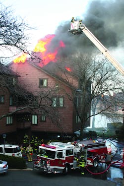 SECAUCUS, NJ, APRIL 3, 2011 &ndash; A woman clinging to her third-floor window fell to her death as flames consumed her apartment in a Meadowlands waterfront housing complex. Police arrived and found the woman, in her 50s, holding onto the window, but she could not hold on until fire companies arrived. The fire extended above and broke through the roof. A second alarm was transmitted, bringing in fire companies from nearby Bergen County.