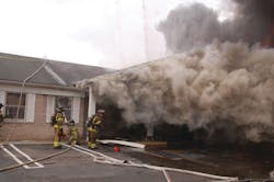 The fire intensified after the backdraft occurred. Heavy smoke was showing from the single-story office building on arrival of the first apparatus.