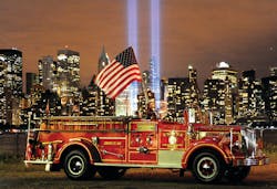 FDNY Engine 343, honoring the members who died on 9/11, is pictured in front of the Tribute in Lights memorial at Ground Zero.