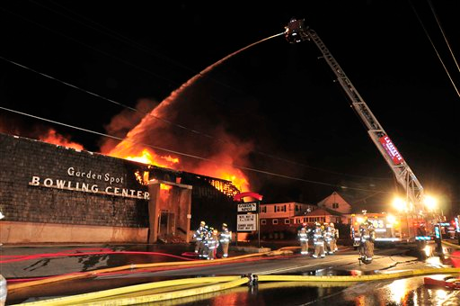 Firefighters from more than 50-area companies battle a fire that tore through Garden Spot Bowling Center, on N. Decatur Street in Strasburg, Pa.