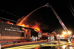 Firefighters from more than 50-area companies battle a fire that tore through Garden Spot Bowling Center, on N. Decatur Street in Strasburg, Pa. Firefighters from more than 50-area companies battle a fire that tore through Garden Spot Bowling Center, on N. Decatur Street in Strasburg, Pa.