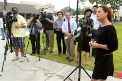 Nikki Araguz, the transgender widow of Wharton firefighter Thomas Araguz, killed in the line of duty in 2010, gives a statement outside the Wharton County Courthouse on May 20.
