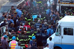 Firefighters from Rescue Company 4 carry Firefighter Brian Fahey, killed in the line of duty from the fire building to an ambulance as remaining firefighters remove their helmets in silent tribute. Emile Wamsteker/The New York Times/Redux Firefighters from Rescue Company 4 carry Firefighter Brian Fahey, killed in the line of duty from the fire building to an ambulance as remaining firefighters remove their helmets in silent tribute. Emile Wamsteker/The New York Times/Redux