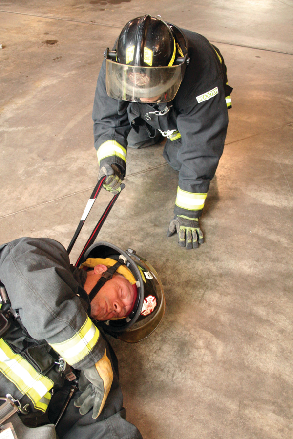 The loop on the Drag Rescue Device is designed to be used by one firefighter to help drag a strickened firefighter to safety.