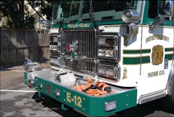 The front bumper on Engine 12 provides room for a recessed front suction, trash line and two hose wells. The front bumper on Engine 12 provides room for a recessed front suction, trash line and two hose wells.