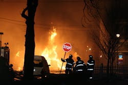 An A Division second-alarm company monitors an unmanned deluge gun covering the D exposure. An A Division second-alarm company monitors an unmanned deluge gun covering the D exposure.