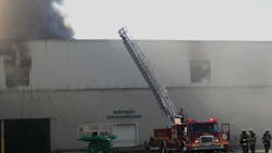 Engine 32 is repositioned Thursday morning to apply a master stream to the roof of side C. Engine 32 is repositioned Thursday morning to apply a master stream to the roof of side C.