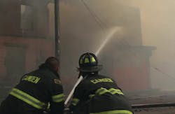 Firefighters battle a massive 12-alarm blaze Thursday at a former tire-distribution facility in Camden. Firefighters battle a massive 12-alarm blaze Thursday at a former tire-distribution facility in Camden.