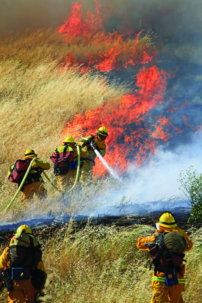 MONTEREY COUNTY, CA, MAY 30, 2011 &ndash;The U.S. Forest Service, three air tankers, three helicopters, 10 engines, a dozer and several hand crews attacked a fire that involved 500 acres of grass and brush near homes outside San Ardo. First-arriving units found a downed power line had spread flames into the grass, with 30 acres of fire being pushed by strong winds. Before the afternoon was over, 500 acres were consumed and the incident commander reported the potential for 5,000 acres if the strong winds did not cease. By 6:45 P.M., the 50-mph winds did subside, letting firefighting resources corral the fire.