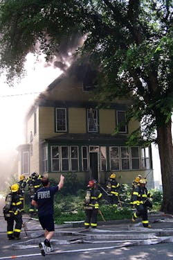 A firefighter points towards the attic moments after the explosion rocked the fireground. A firefighter points towards the attic moments after the explosion rocked the fireground.