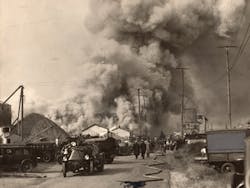 Heavy smoke pours from a seven-alarm fire at Pier 7 in Baltimore, MD, on Oct. 15, 1932.
