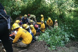 Crews with Hillsboro Fire Rescue successfully rescued an elderly man after the bulldozer he was driving went off a 15-foot embankment trapping him under it.