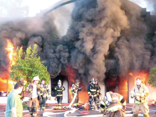 The smashing of the front windows 24 minutes into the incident provided oxygen to the slow-moving fire, which then rapidly spread.