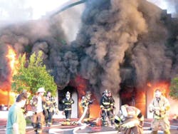 The smashing of the front windows 24 minutes into the incident provided oxygen to the slow-moving fire, which then rapidly spread.