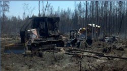 Two Florida firefighters were killed trying to retrieve a stuck tractor when the Blue Ribbon Fire, in Hamilton County, overran them. Two Florida firefighters were killed trying to retrieve a stuck tractor when the Blue Ribbon Fire, in Hamilton County, overran them.