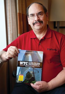 Firehouse Magazine Editor Harvey Eisner poses with a copy of his new book &apos;WTC In Their Own Words.&apos;