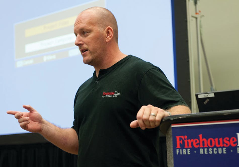 Fort Worth Fire Capt. Larry Manasco speaks at Firehouse Expo 2011 about a close call last year in which he and six of his colleagues became trapped.