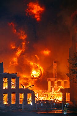 Heavy timbers that once supported the center portion of the mill's floors and an outside wall collapsed and produced a large fire ball that rolled upwards into the sky. Heavy timbers that once supported the center portion of the mill's floors and an outside wall collapsed and produced a large fire ball that rolled upwards into the sky.