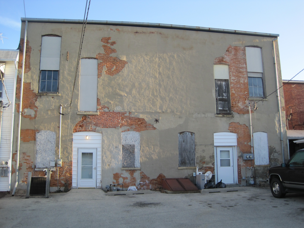 Figure 7. What important tasks should the rapid intervention team be undertaking? What communications to the rest of the fireground companies should be taking place when the rapid intervention team is operating in the rear of a structure in the condition as the one shown?