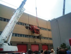 A New York Department of Sanitation salt-spreading truck crashed through a wall on the second floor of a repair shop in the Queens borough of New York. A New York Department of Sanitation salt-spreading truck crashed through a wall on the second floor of a repair shop in the Queens borough of New York.