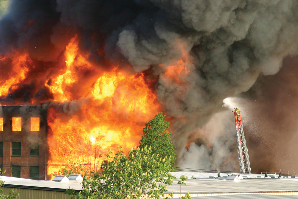 Cattaraugus Ladder 6 protects Salamanca Lumber and McHone Industries, which were being threatened by radiant heat and flying embers.