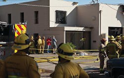 An off-duty Los Angeles firefighter and another man were critically injured after an explosion tore through an alternative-energy company in Sylmar Tuesday.