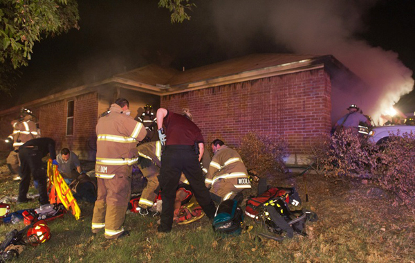 Fort Worth firefighters work a man and woman that were rescued from their home at 8101 Arbor by firefighters and police around 330am Tuesday. The woman was taken to Parkland with smoke inhalation and burns while the man was taken by ground to Harris Hospital. Their daughter was also taken to the hospital with respiratory issues. The cause was under investigation according to PIO Captain Tom Crow.