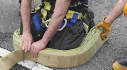 Photo 1. When packing the first hose pack, start with the female coupling at your left ankle and continue to go from one ankle to the other.
