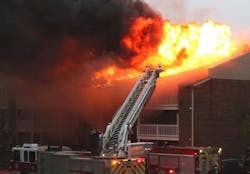Crews battled a three-alarm fire at an apartment complex in Speedway on Thursday that left dozens of families without homes.