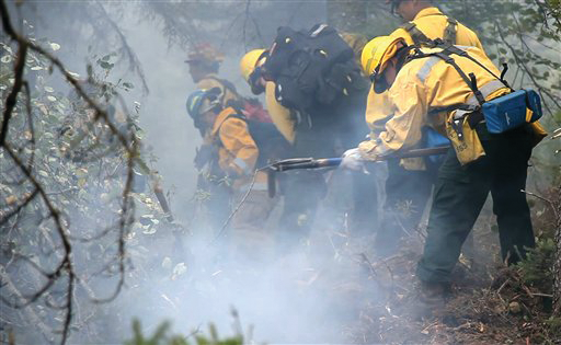 Fire crews dig a fire line on the southern edge of the Pagami Creek Fire, north of Isabella, Minn.