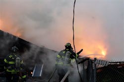 Seattle firefighters work to extinguish a fire at a home in Seattle following a large explosion. Seattle firefighters work to extinguish a fire at a home in Seattle following a large explosion.