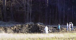 In this Tuesday, Sept. 11, 2001 file photo, emergency workers look at the crater created when United Airlines Flight 93 crashed near Shanksville, Pa. In this Tuesday, Sept. 11, 2001 file photo, emergency workers look at the crater created when United Airlines Flight 93 crashed near Shanksville, Pa.