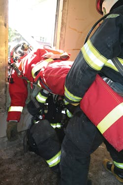 Figure 2. Practicing techniques for firefighter removals in constricted spaces and out windows is a necessary skill for RIT members.