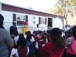 Osric Wilson, Assistant Fire Marshal, Detroit Fire Department; Sparky the Fire Dog; Capt. Chris Dixon, Detroit Fire Department; Judy Comoletti, division manager of public education, NFPA; Second Grade students from the Detroit Edison Public School Academy.