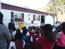 Osric Wilson, Assistant Fire Marshal, Detroit Fire Department; Sparky the Fire Dog; Capt. Chris Dixon, Detroit Fire Department; Judy Comoletti, division manager of public education, NFPA; Second Grade students from the Detroit Edison Public School Academy. Osric Wilson, Assistant Fire Marshal, Detroit Fire Department; Sparky the Fire Dog; Capt. Chris Dixon, Detroit Fire Department; Judy Comoletti, division manager of public education, NFPA; Second Grade students from the Detroit Edison Public School Academy.