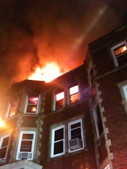 Firefighters rescued at least 15 people after an explosion sparked a massive fire that tore through a large apartment building early Monday. Firefighters rescued at least 15 people after an explosion sparked a massive fire that tore through a large apartment building early Monday.