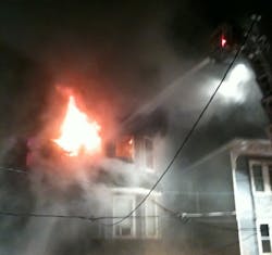 Boston firefighters battled a five-alarm blaze in Mission Hill early Sunday morning that quickly spread to two multifamily homes.