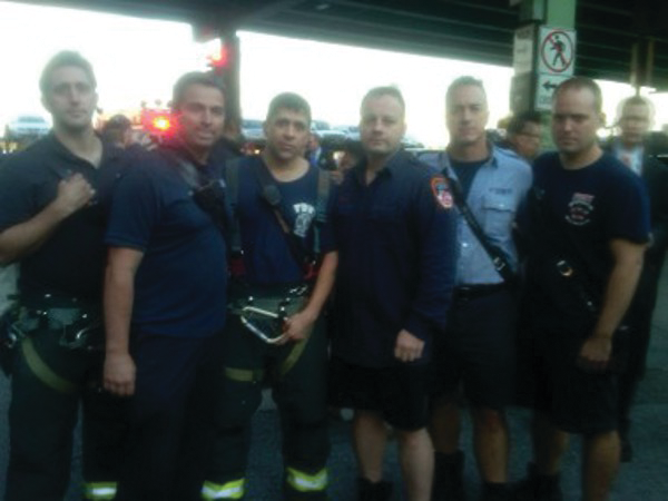 Members of Ladder 7, including Firefighter Robert Lopez, third from the right.