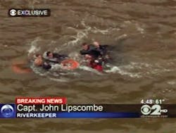 In this frame grab image taken from WCBS-TV, survivors are pulled ashore by rescue workers following a crash in the East River in New York.