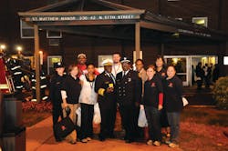 Firefighter Leary (far left), Red Paw and American Red Cross Southeastern Pa. volunteers, Philadelphia Fire Commissioner Lloyd Ayers (fourth from left) and Lieutenant Michael Grant (third from right) at the Philadelphia citywide fire drill. Firefighter Leary (far left), Red Paw and American Red Cross Southeastern Pa. volunteers, Philadelphia Fire Commissioner Lloyd Ayers (fourth from left) and Lieutenant Michael Grant (third from right) at the Philadelphia citywide fire drill.