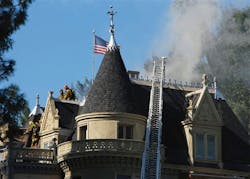 Firefighters work to extinguish a blaze at the Magic Castle in the Hollywood section of Los Angeles. Firefighters work to extinguish a blaze at the Magic Castle in the Hollywood section of Los Angeles.