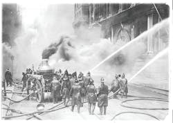 Powerful handlines are directed into the blazing building during the early stages of the fire. Powerful handlines are directed into the blazing building during the early stages of the fire.