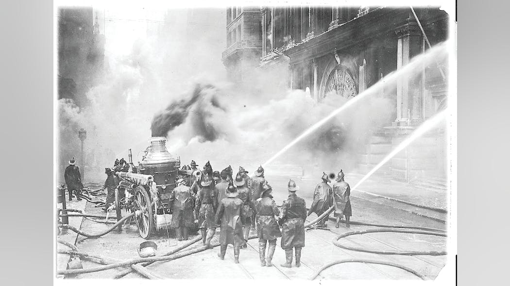 Powerful handlines are directed into the blazing building during the early stages of the fire.