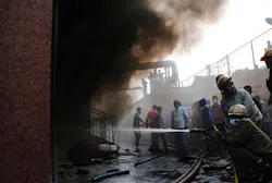 Firefighters work to extinguish a fire at a private hospital in Kolkata, India on Dec. 9.