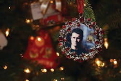 Photographs with heartfelt messages adorn two trees in the National Fallen Firefighters Memorial Chapel. Photographs with heartfelt messages adorn two trees in the National Fallen Firefighters Memorial Chapel.