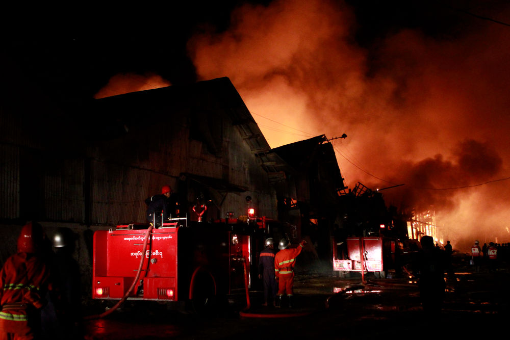 Smoke and blaze rise from a warehouse in Pazundaung township, eastern Yangon suburb, Myanmar on Dec. 29.